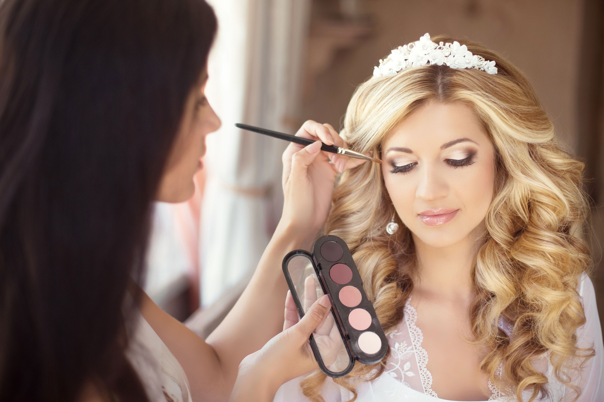 Beautiful bride wedding with makeup and curly hairstyle. Stylist